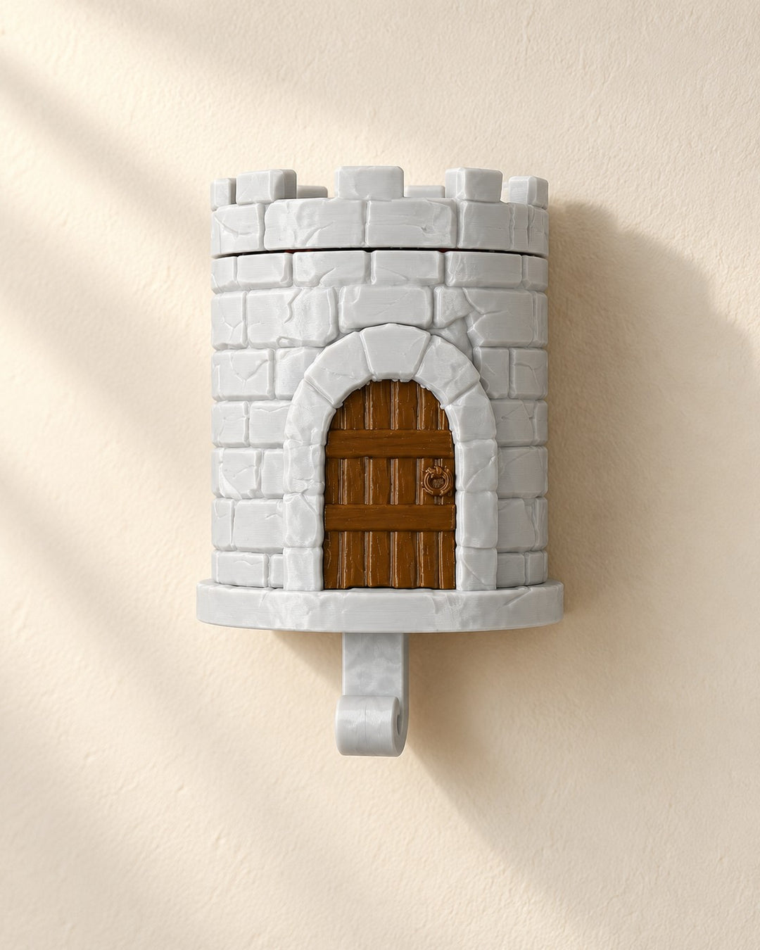 Pop-Up Dragon Key Holder: A castle tower key hook where a small red dragon rises as you hang your keys