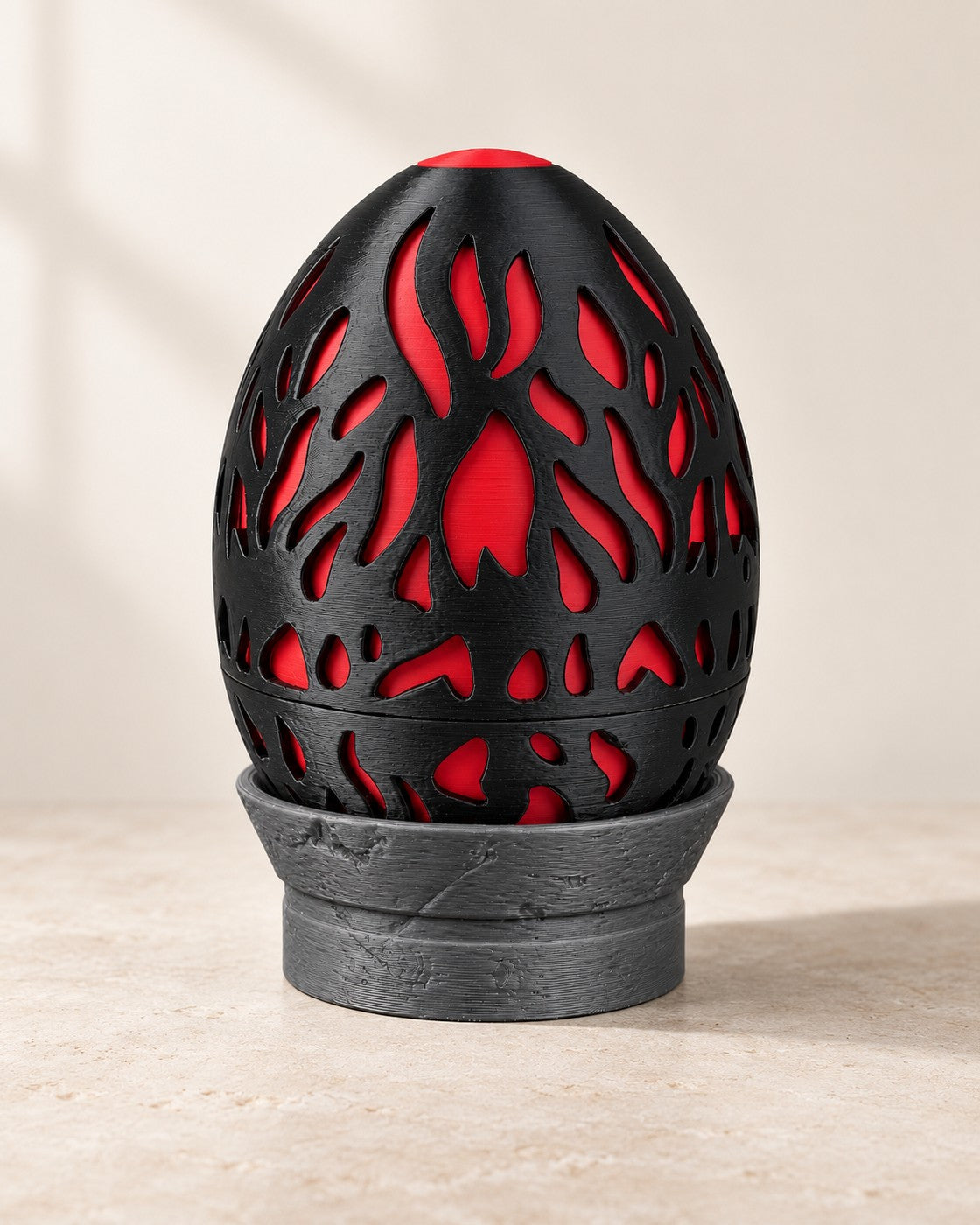 Magma Dragon Egg Box on a pale limestone plinth, soft studio light