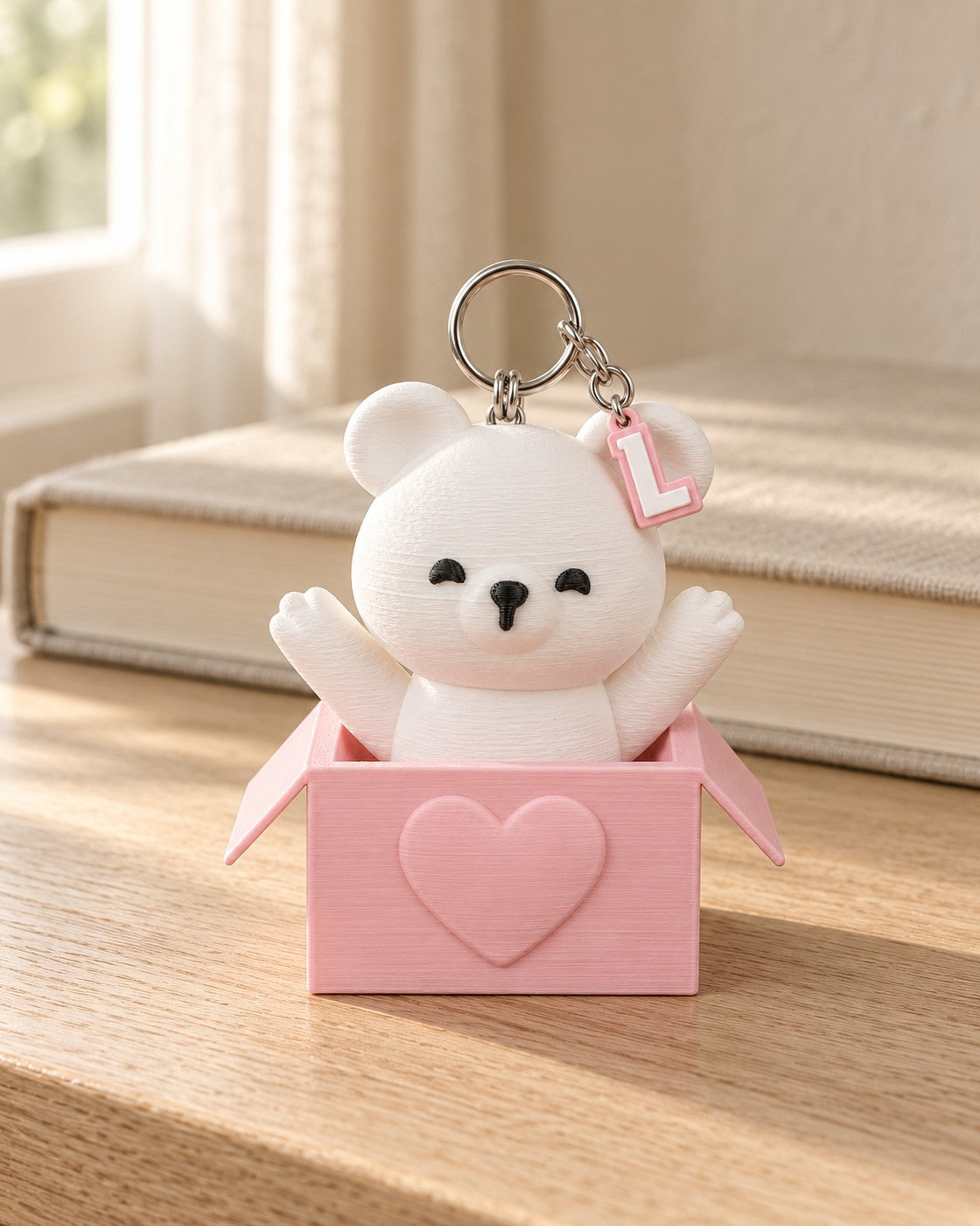 Peek-a-Bear Initial Keyring in a calm, softly lit interior, shown at true scale