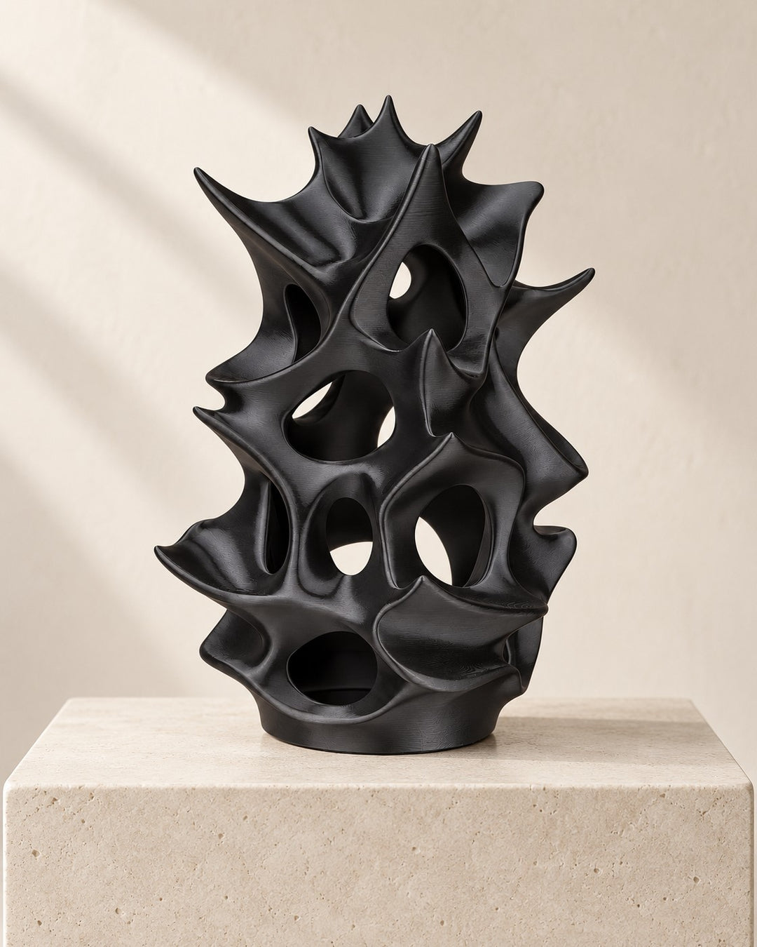 Organic Lattice Lamp: Sculptural black lamp that casts dappled shadows on the wall