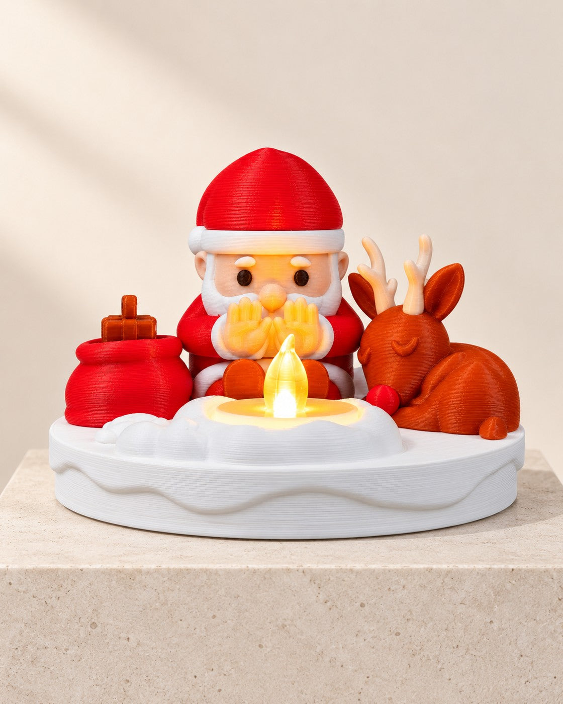 Santa Bonfire Decoration on a pale limestone plinth, soft studio light