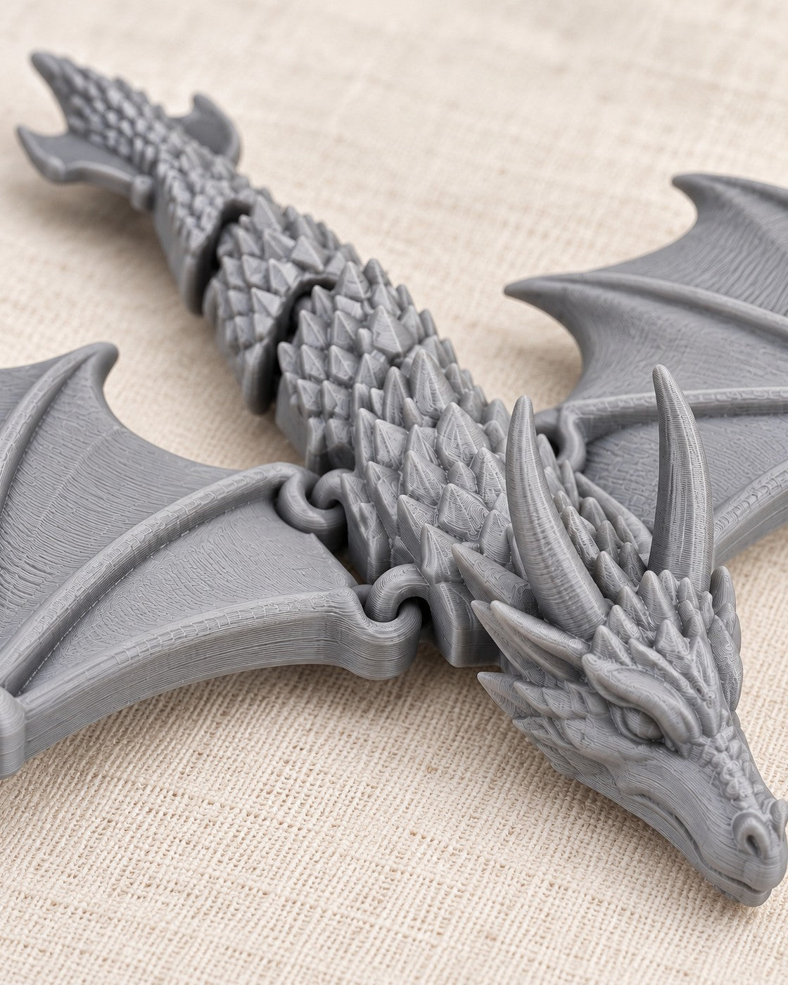 Close-up of the Soaring Fang Necklace showing fine printed layer lines