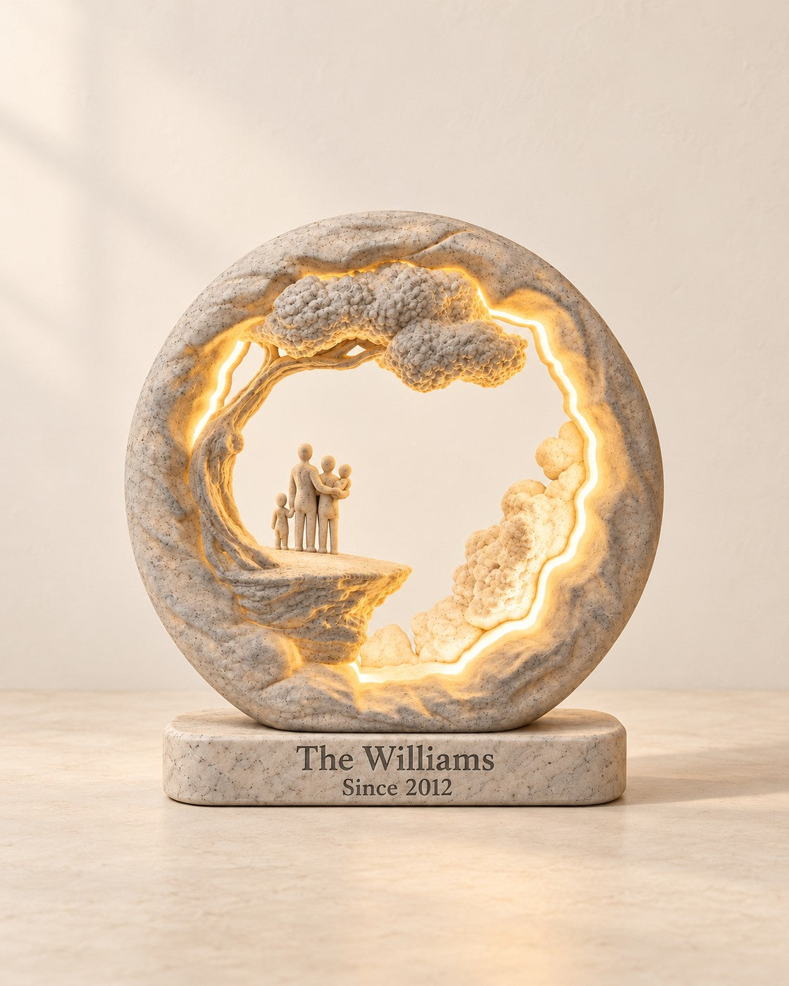 Family Tree Lamp on a pale limestone plinth, soft studio light