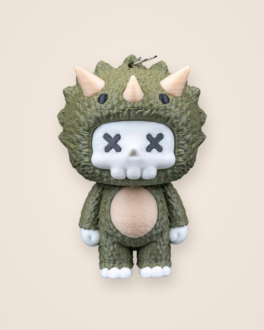 Trixi Skull Keyring: Olive green hooded character charm with a white skull face