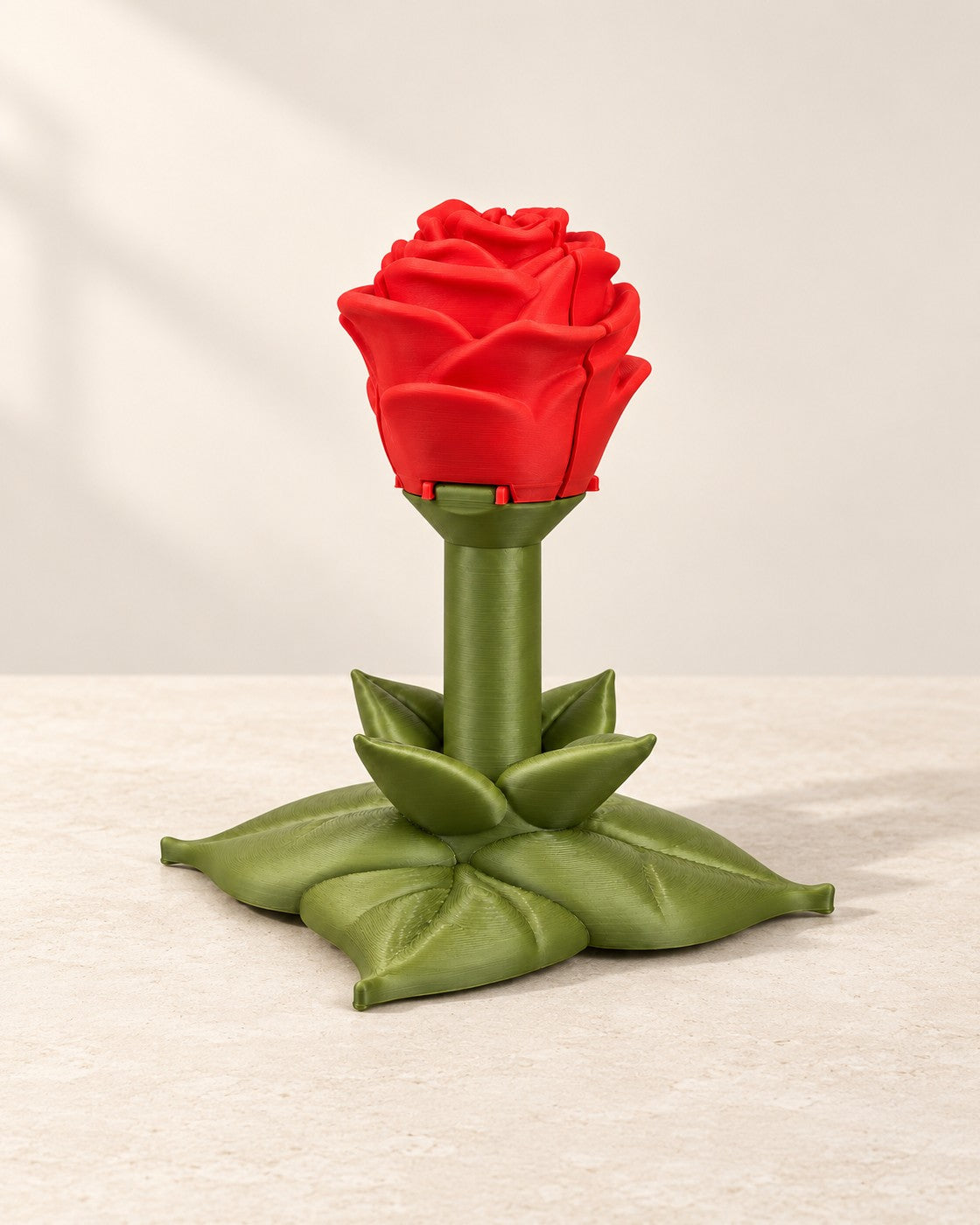 Sweet Rose Container and Ring Box on a pale limestone plinth, soft studio light