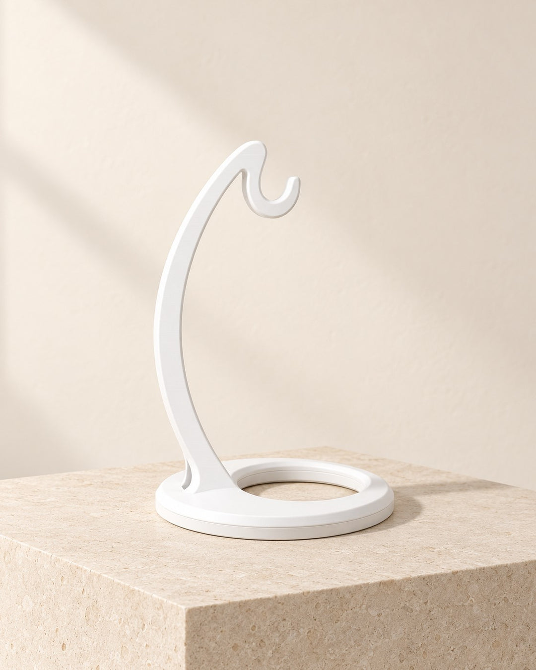 Curved Banana Hanger: Countertop stand that lets a bunch hang freely, in five finishes