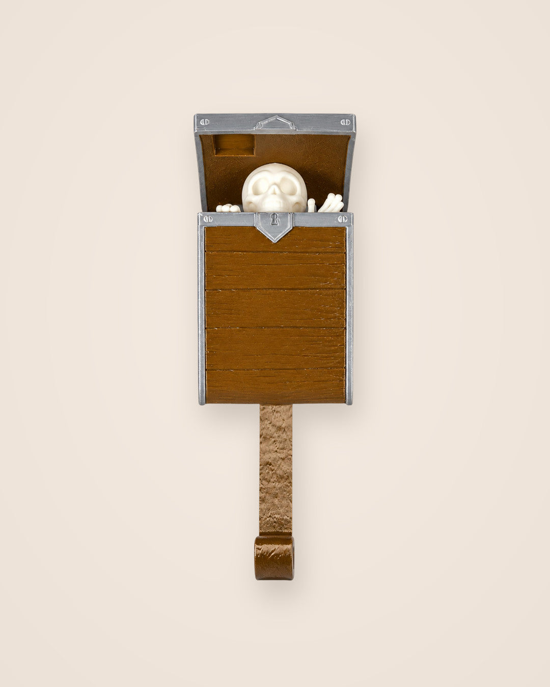 Pop-Up Skeleton Key Holder: Wall hook where a little skeleton rises from a treasure chest