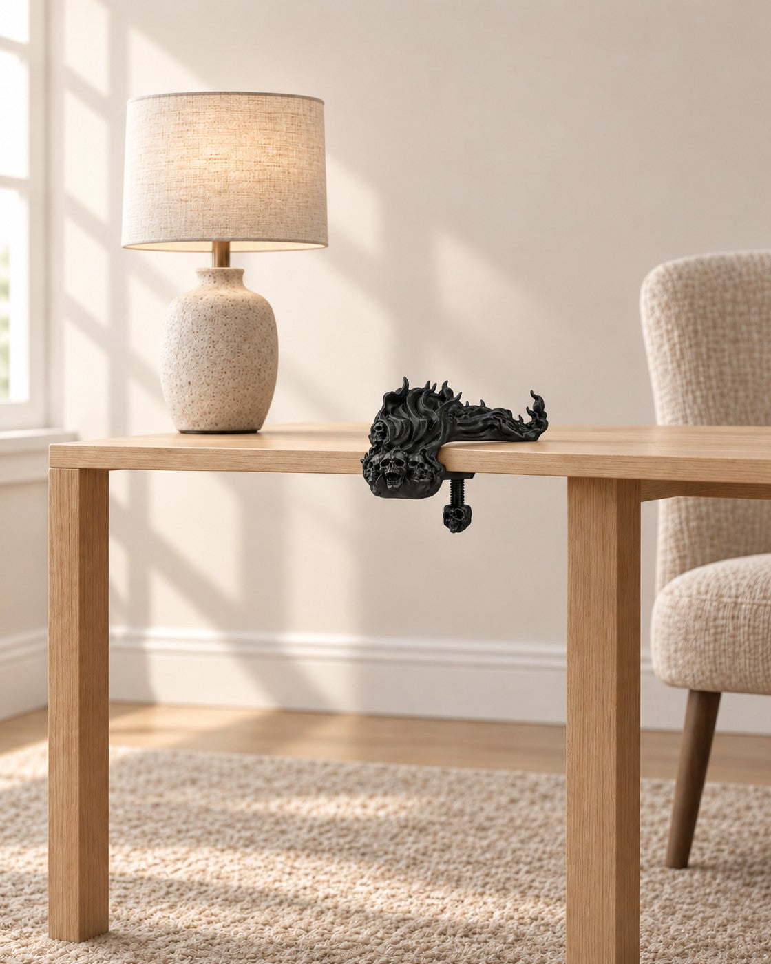 Skull and Flame Headphone Clamp in a calm, softly lit interior, shown at true scale