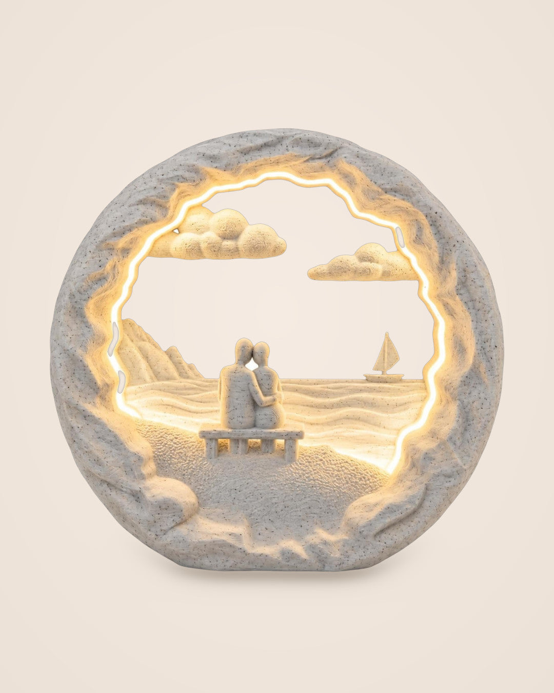 Dockside Dream Couple Lamp: Marble-effect lamp of two figures on a dock, lit by warm LED