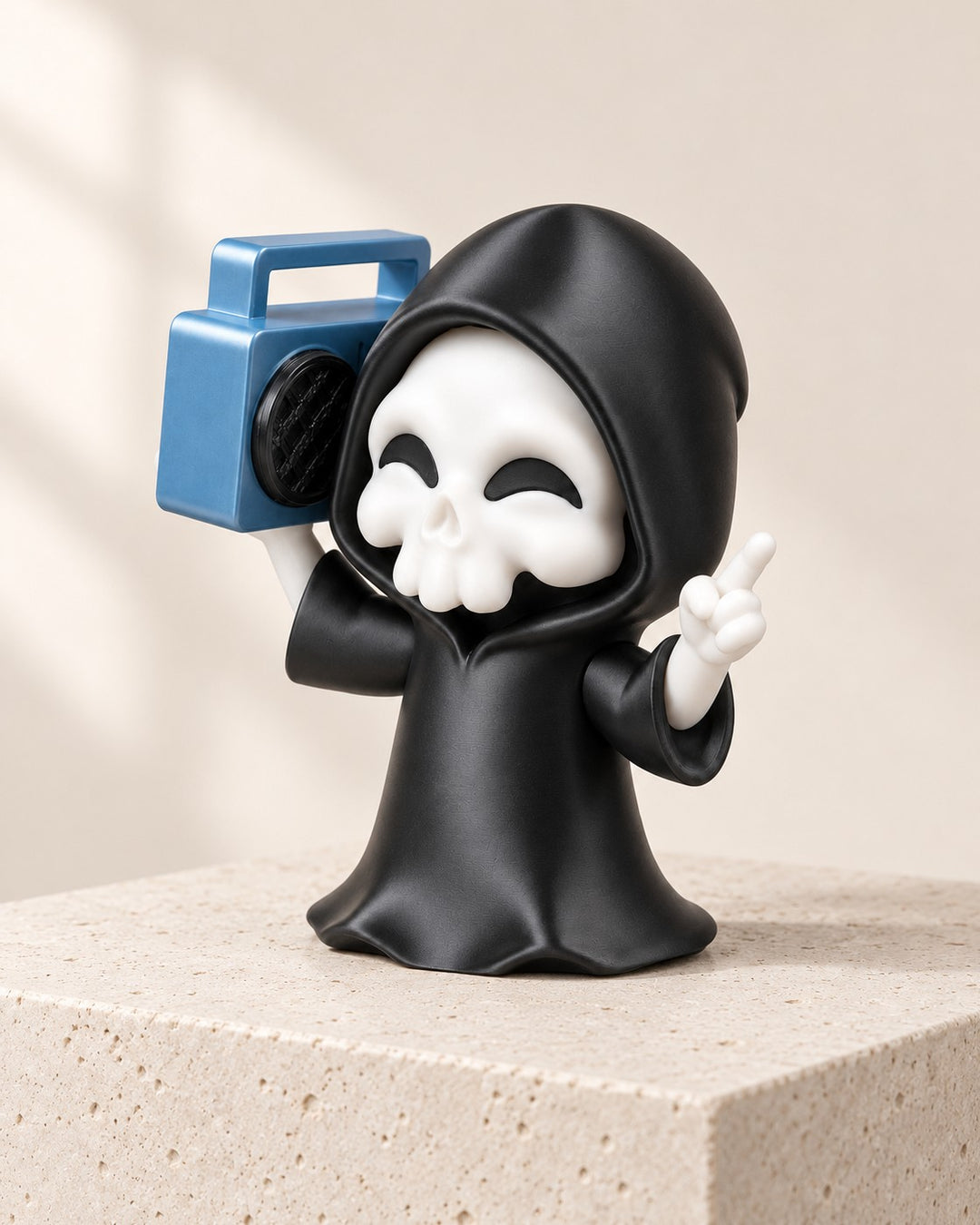 Groove Reaper Figurine: Compact hooded reaper with a sculpted blue boombox