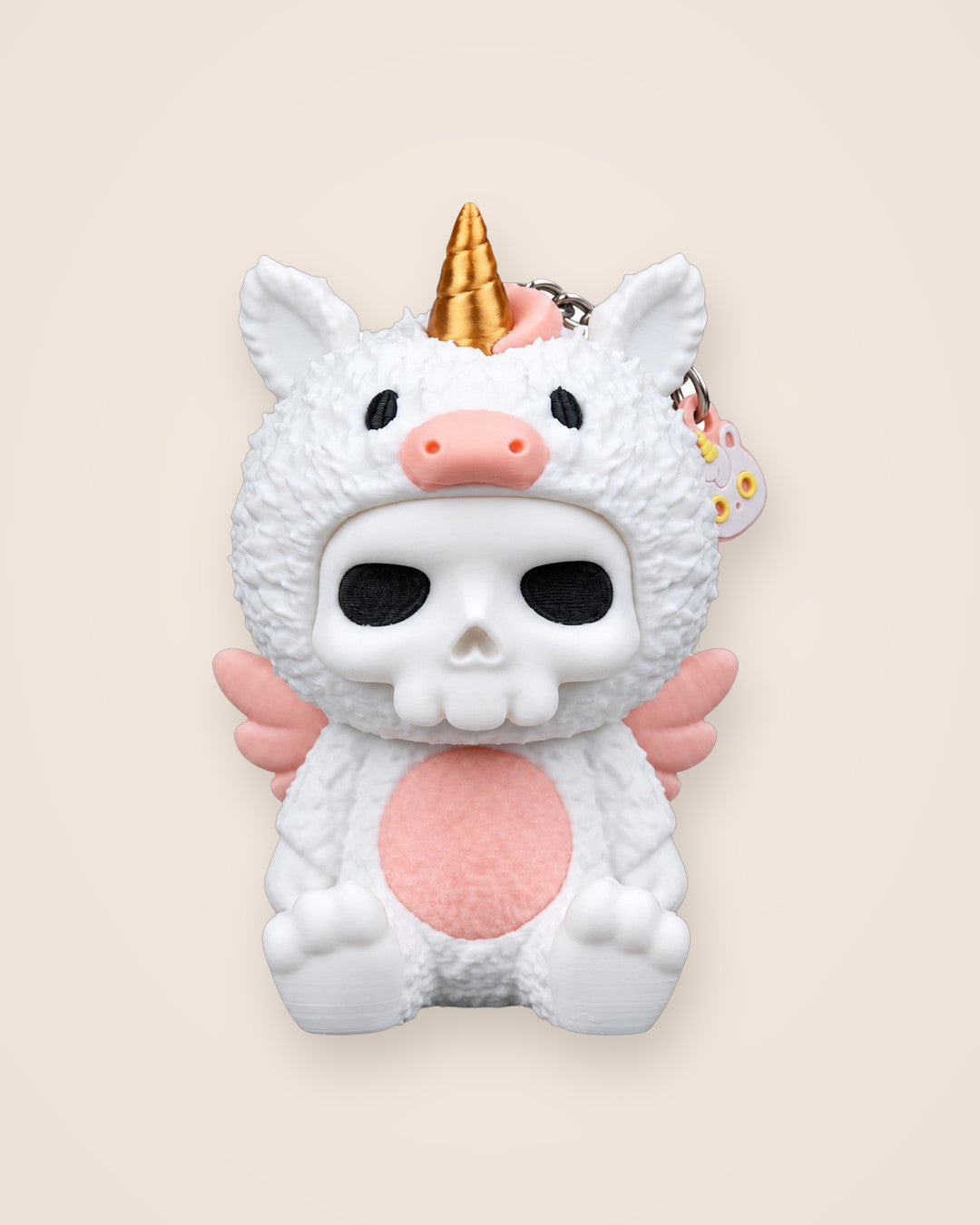Unna Unicorn Keyring: Pastel unicorn costume, unexpected skull face, with a matching mini charm