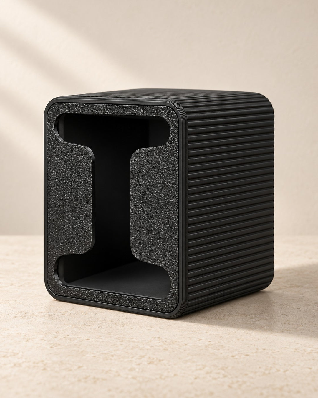 Tea Bag Dispenser: Compact black box with a front-pull opening for wrapped tea bags