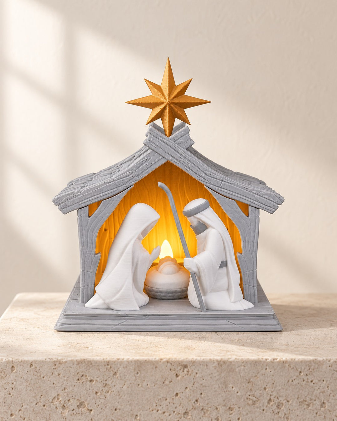 Illuminated Nativity Scene: Holy Family beneath a grey stable and gold-coloured star, lit by an LED candle