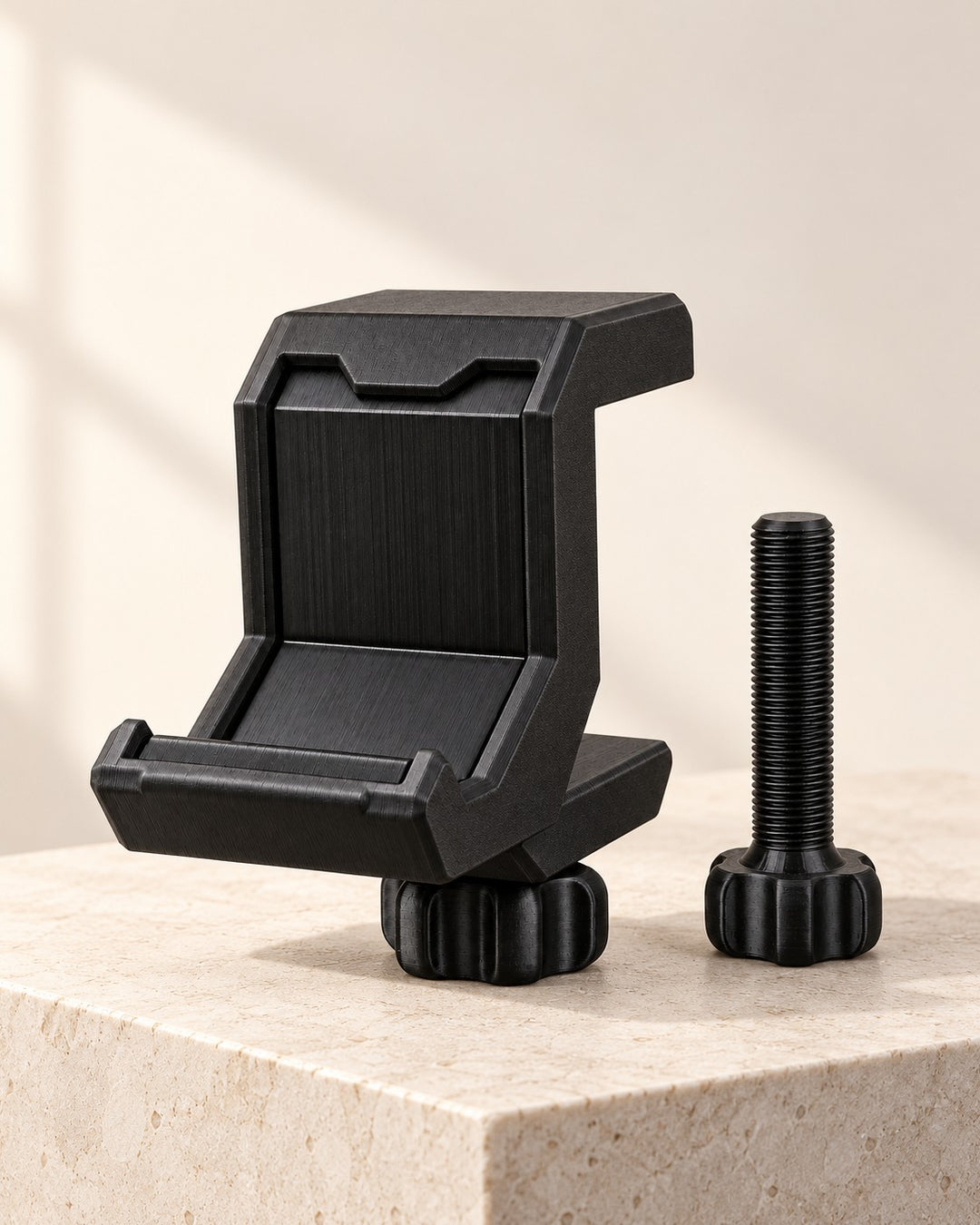Under-Desk Headphone Clamp: Matte black PETG clamp that hangs a headset beneath the desk edge