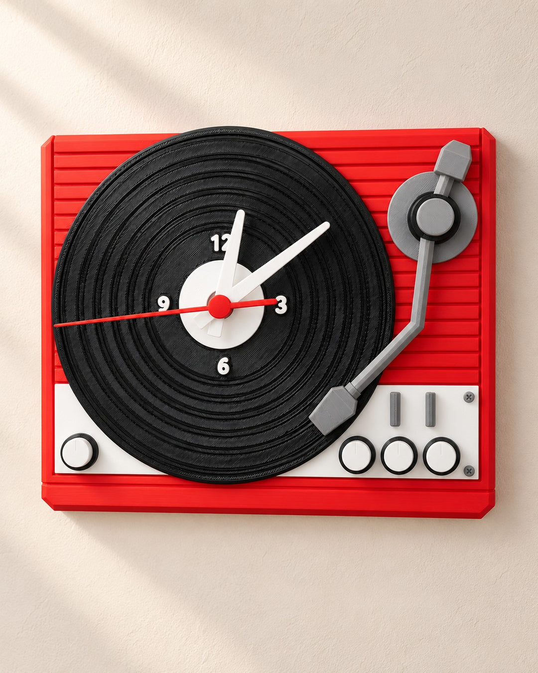 Turntable Wall Clock: Red record-player clock with a grooved vinyl dial and quartz movement