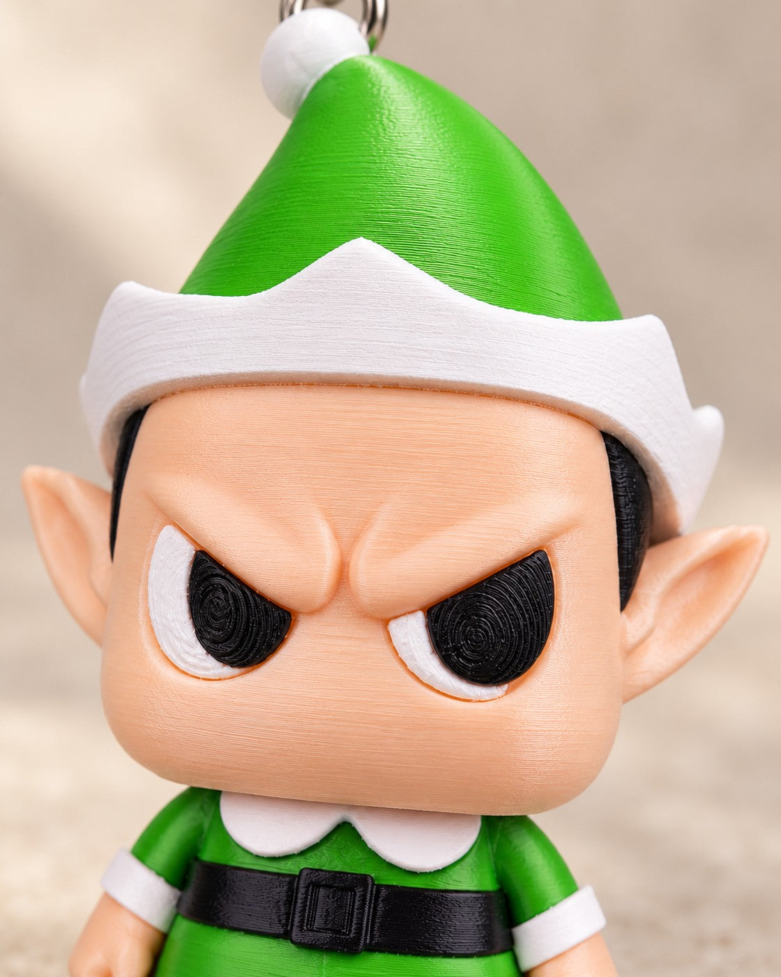 Close-up of the Grumpy Elf Keyring showing fine printed layer lines