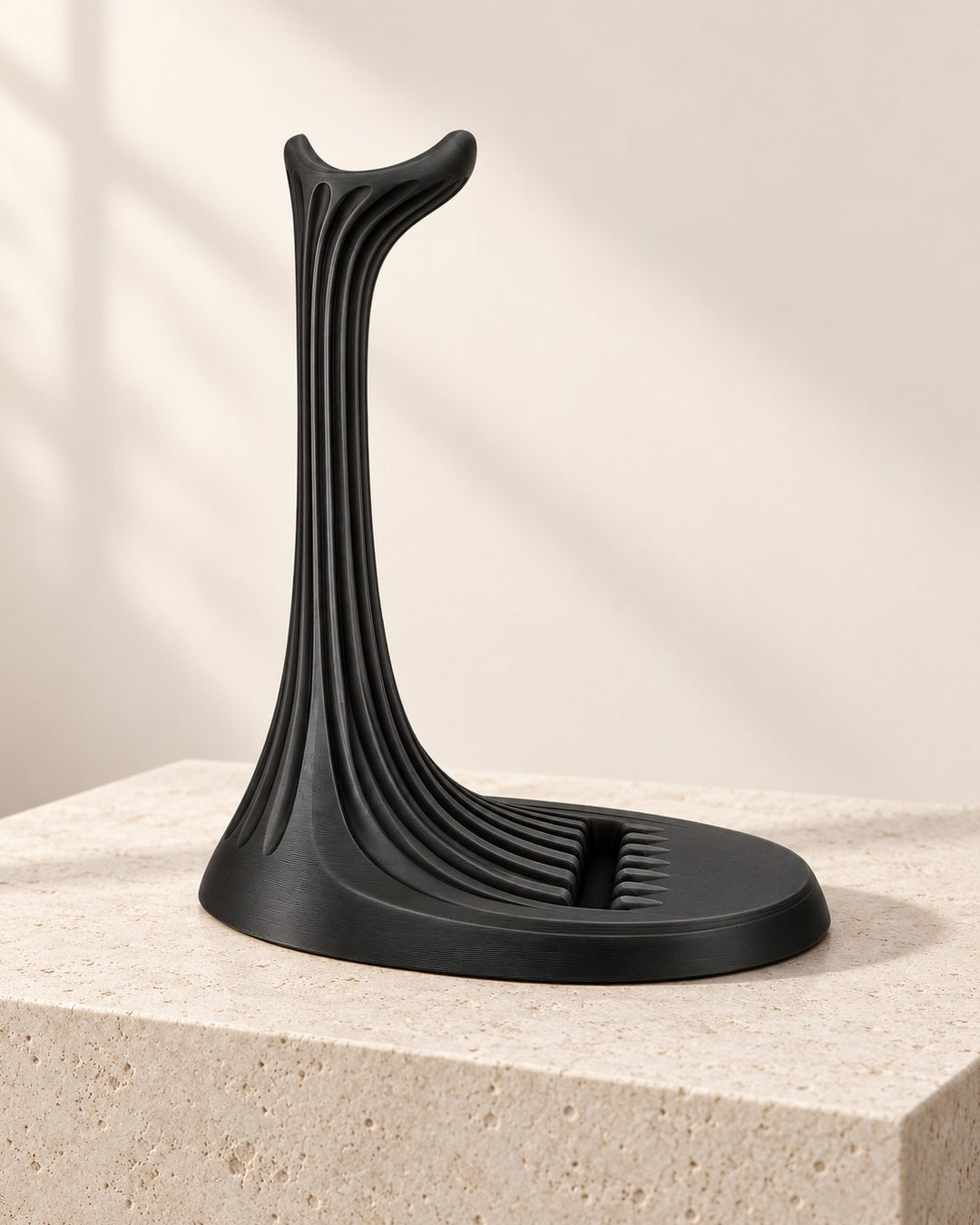 Ribbed Headphone Stand: A sculpted column with a built-in slot for your phone