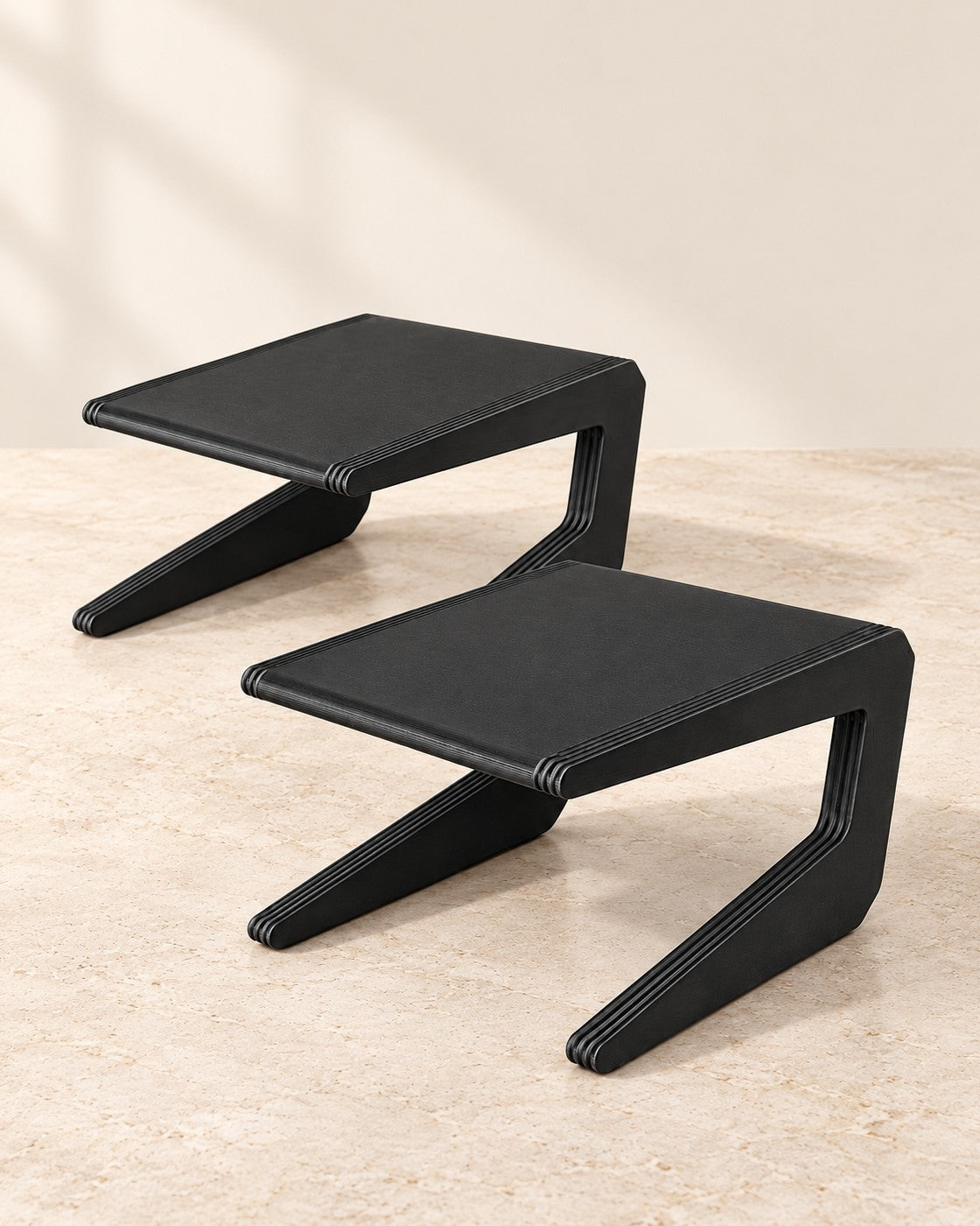 Narrow Shelf Risers on a pale limestone plinth, soft studio light