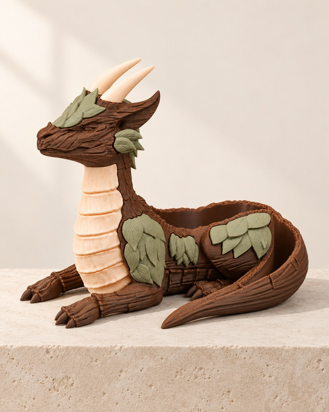 Guardian Dragon Planter on a pale limestone plinth, soft studio light