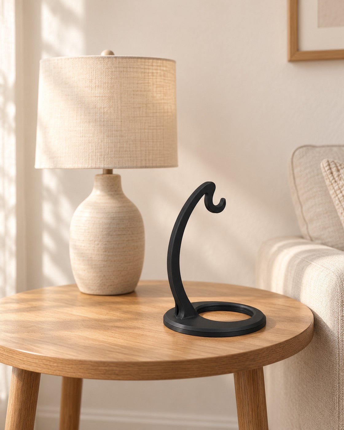 Matte Black Banana Hanger in a calm, softly lit interior, shown at true scale