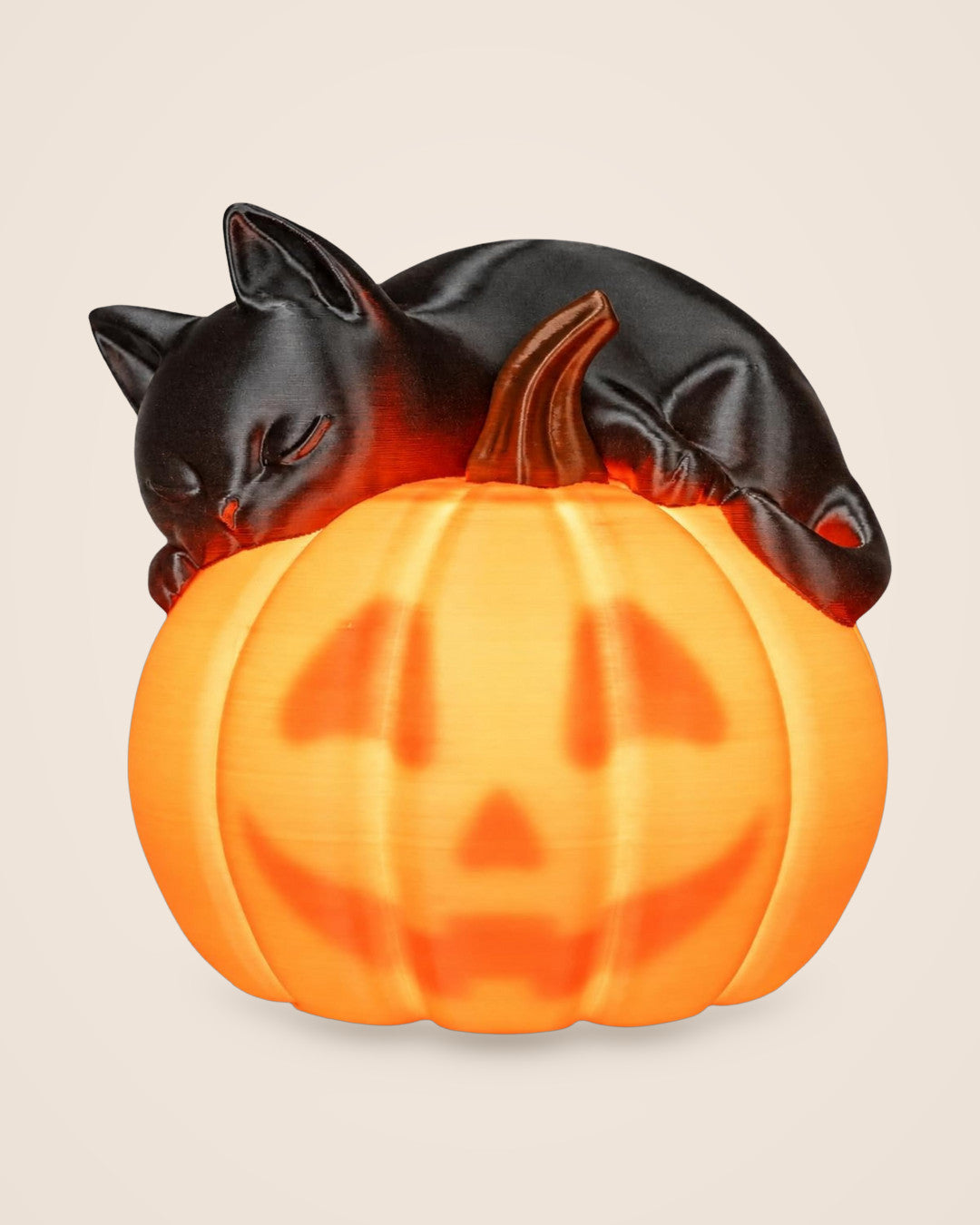 Sleepy Cat Pumpkin Lamp: A black cat dozing on a pumpkin that reveals its face when lit