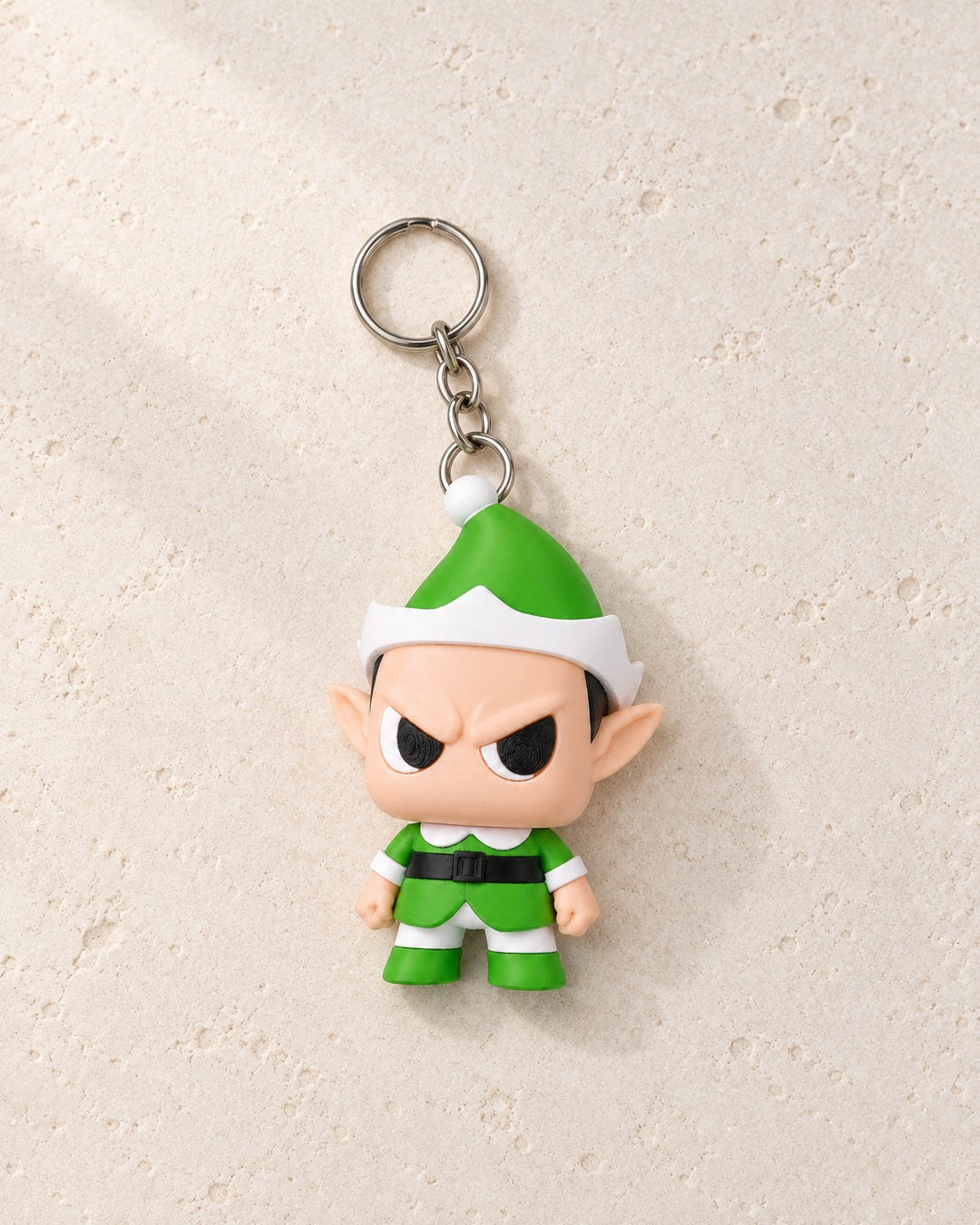 Grumpy Elf Keyring: A scowling festive elf on a split ring and short chain