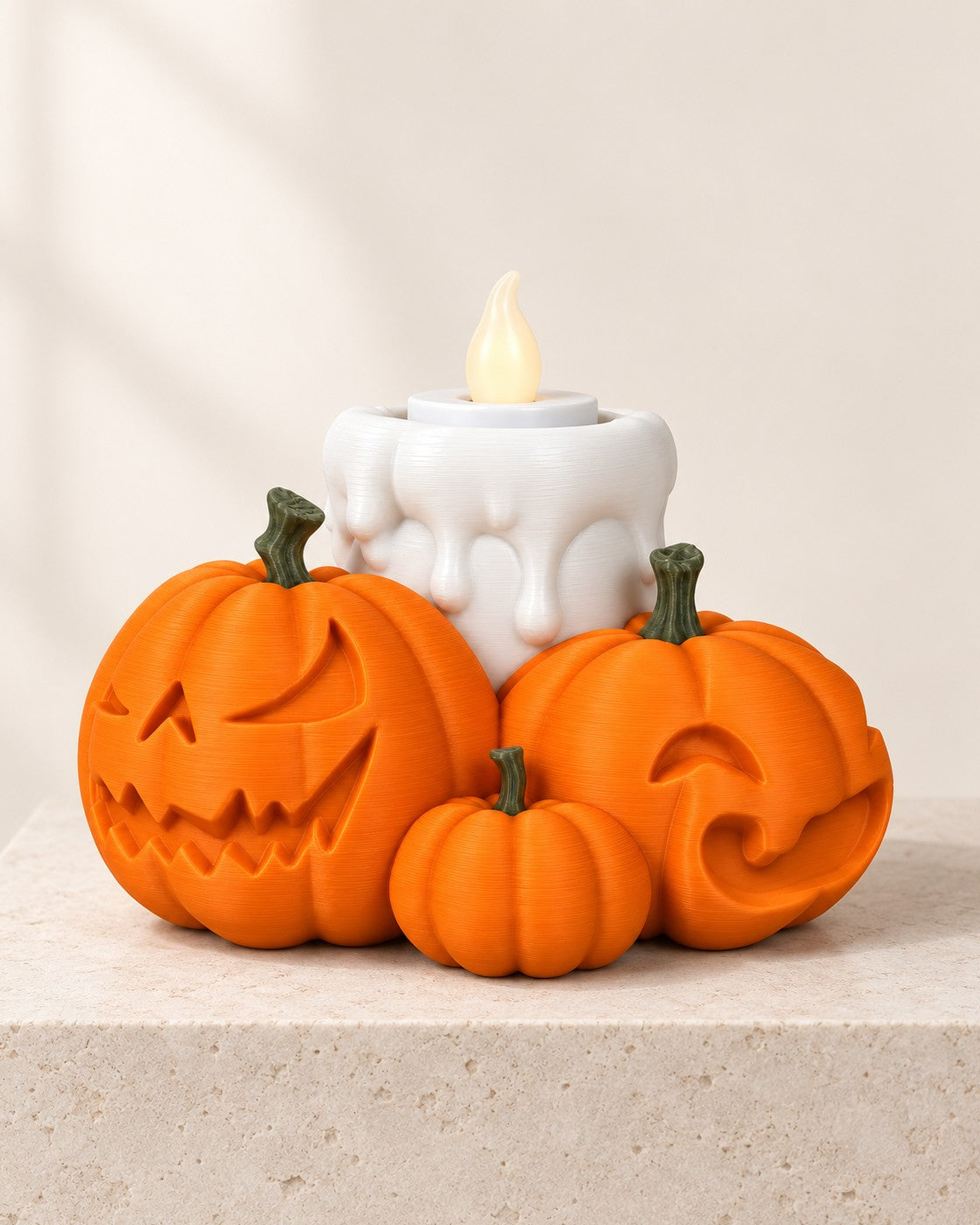 Pumpkin Cluster Tealight Holder on a pale limestone plinth, soft studio light