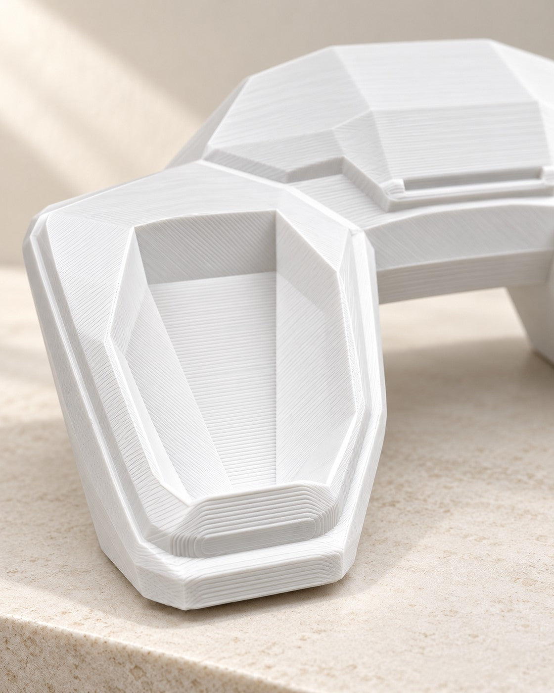 Close-up of the Faceted Controller Stand showing fine printed layer lines
