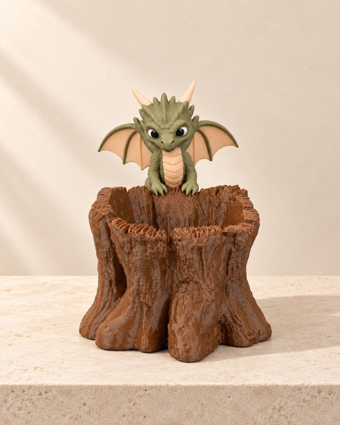 Baby Dragon Stump Planter: Bark-textured planter with a baby dragon keeping watch on the rim