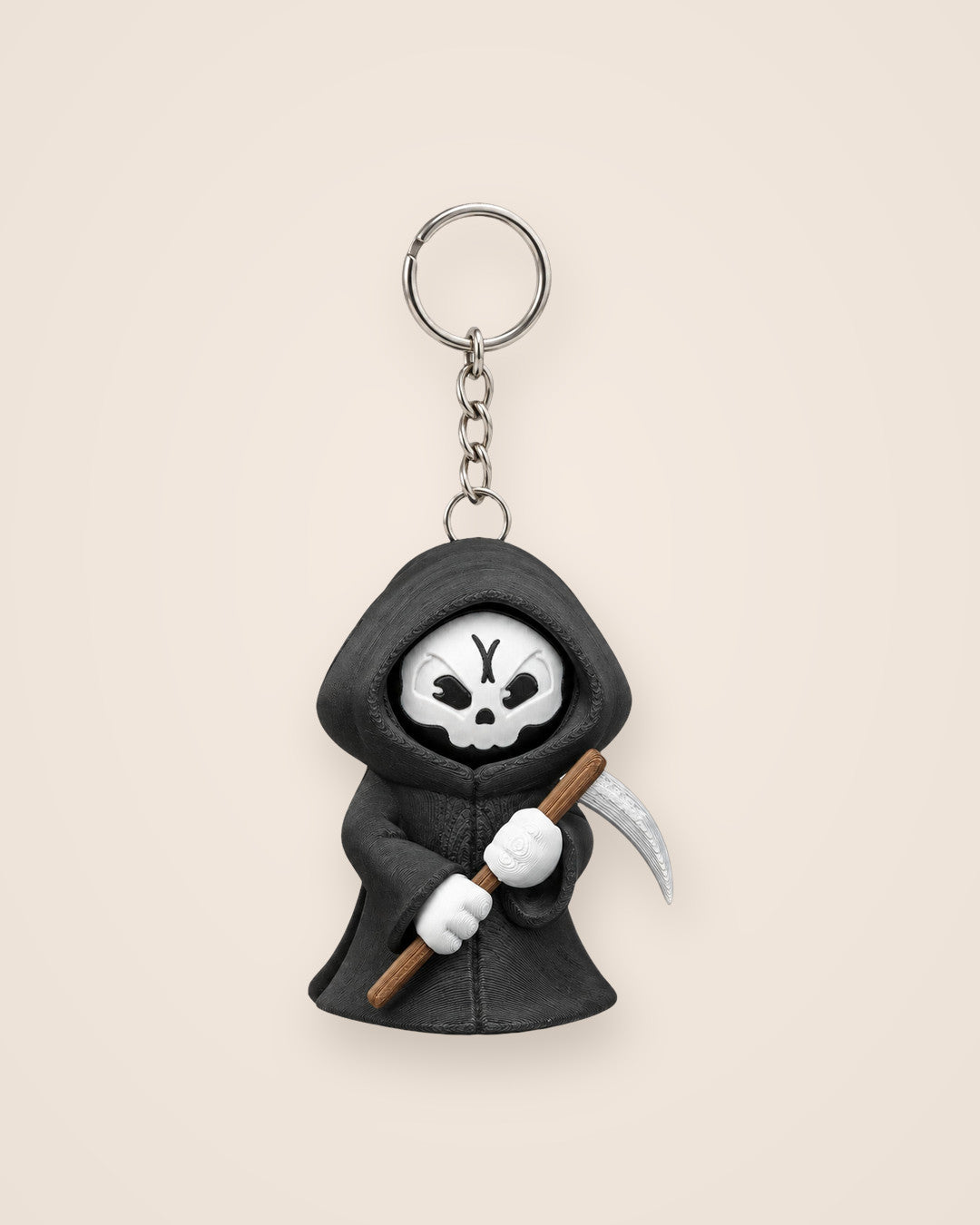 Moody Reaper Keyring: Hooded reaper with a face that turns to show three moods