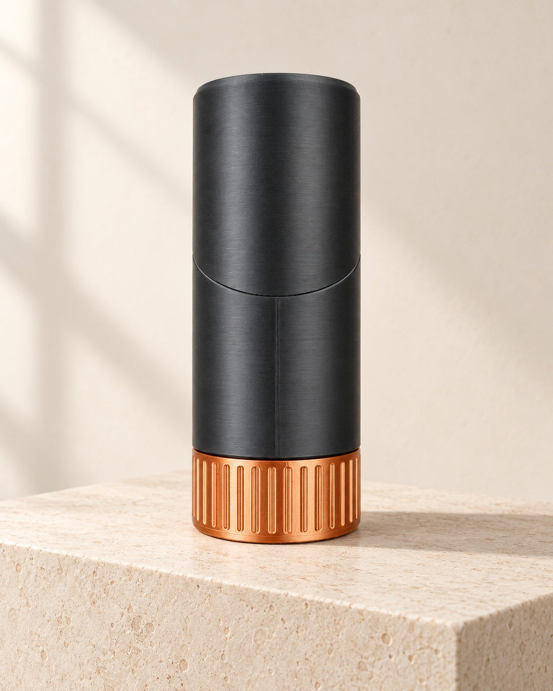 Hidden Pen Headphone Stand: Slim black column with a hinged hood and copper-coloured base