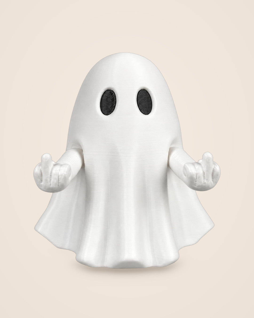 Press-Down Ghost: A draped white ghost whose arms lift when you press its top