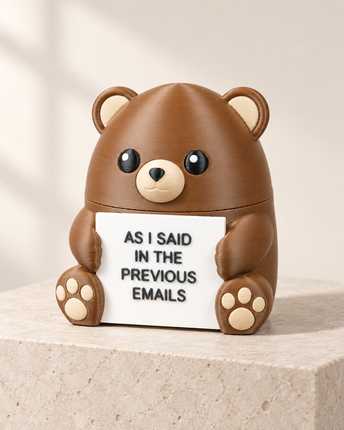 Steady Bear on a pale limestone plinth, soft studio light