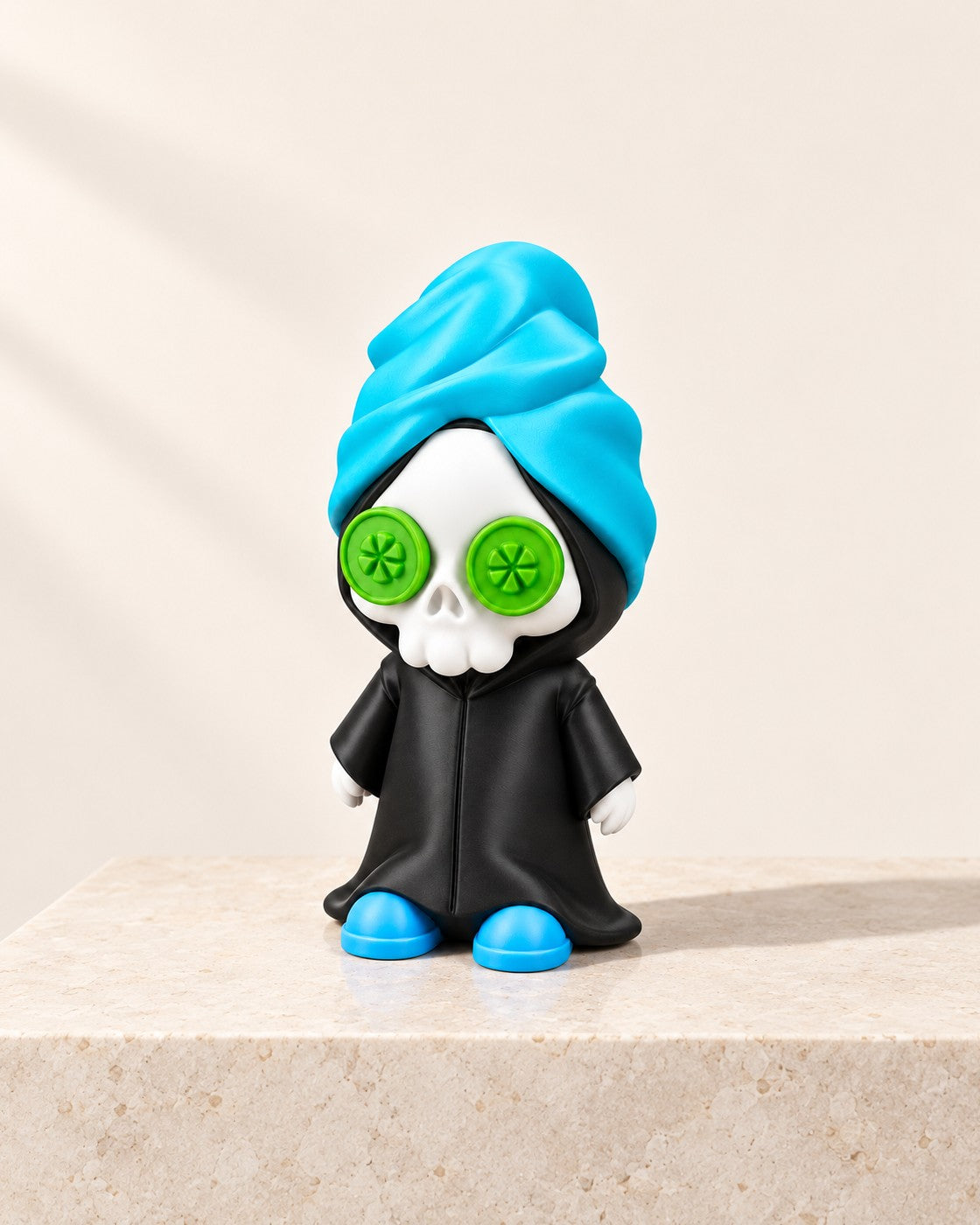 Reap in Peace Figurine on a pale limestone plinth, soft studio light