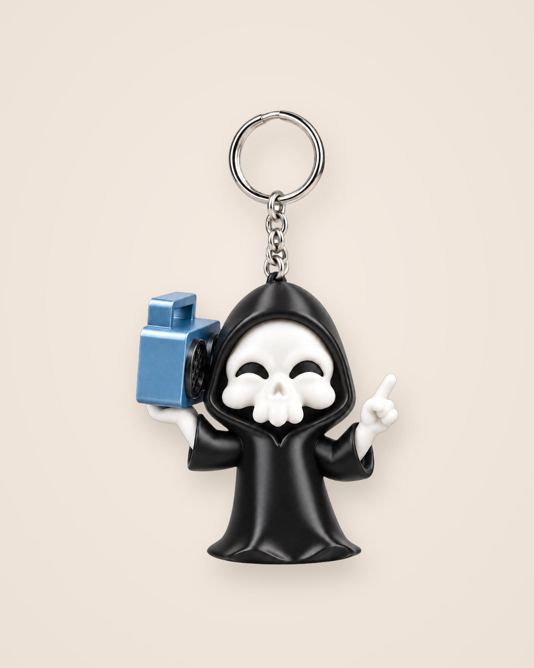 Groove Reaper Keyring: Smiling hooded skull carrying a blue boombox