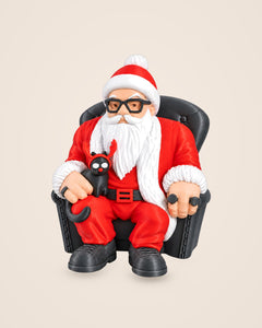 Cool Santa with Cat: A laid-back Father Christmas in an armchair, with a black cat in antlers