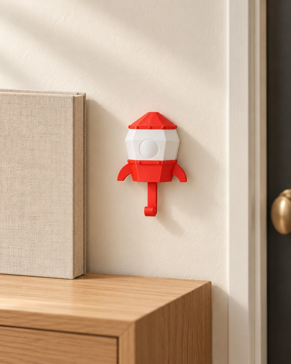 Pop-Up Astronaut Key Holder in a calm, softly lit interior, shown at true scale