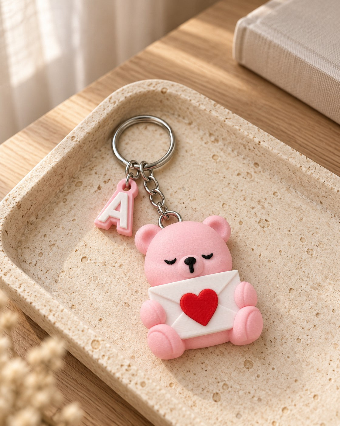 Initial Bear Keyring in a calm, softly lit interior, shown at true scale