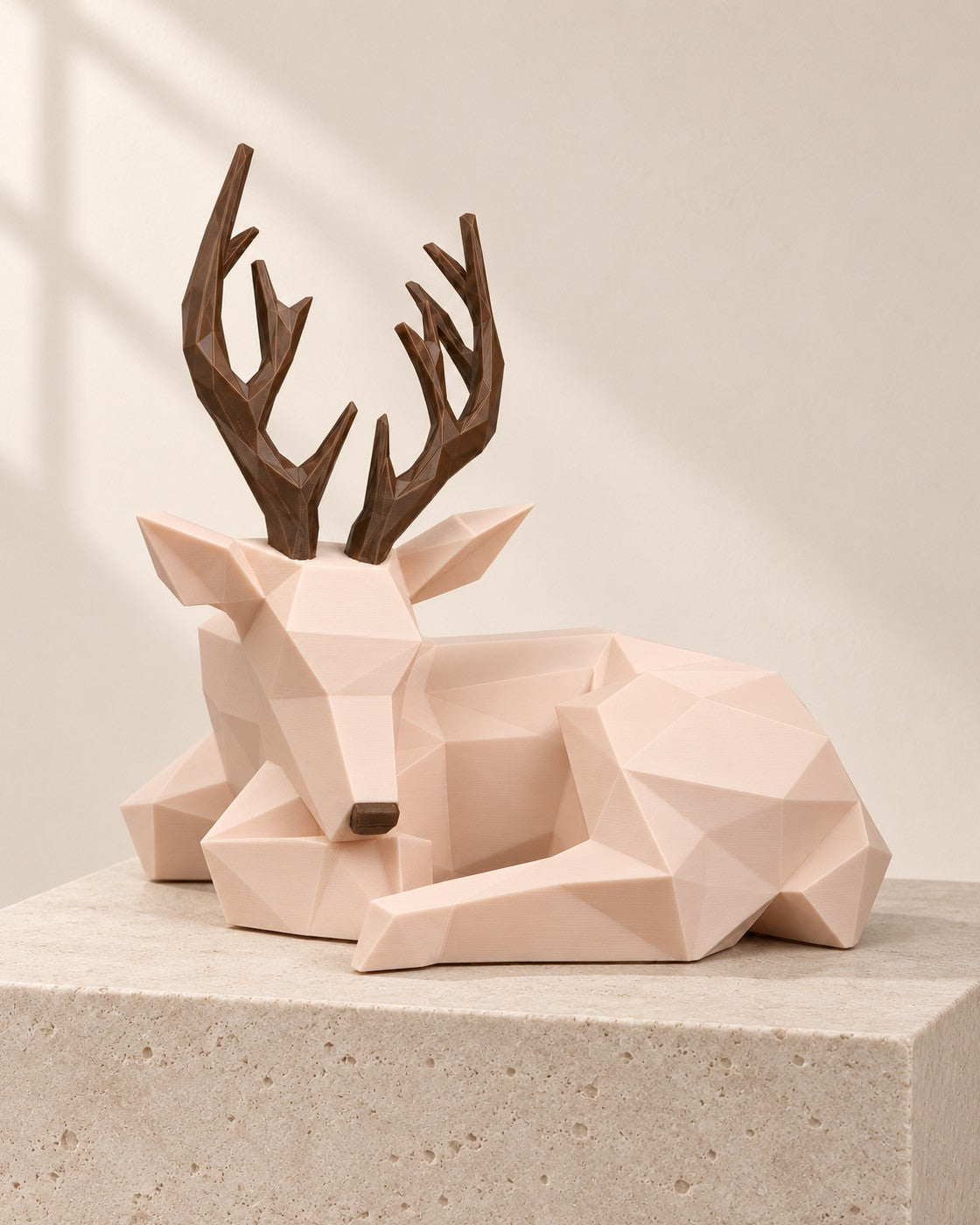Faceted Deer Lamp on a pale limestone plinth, soft studio light