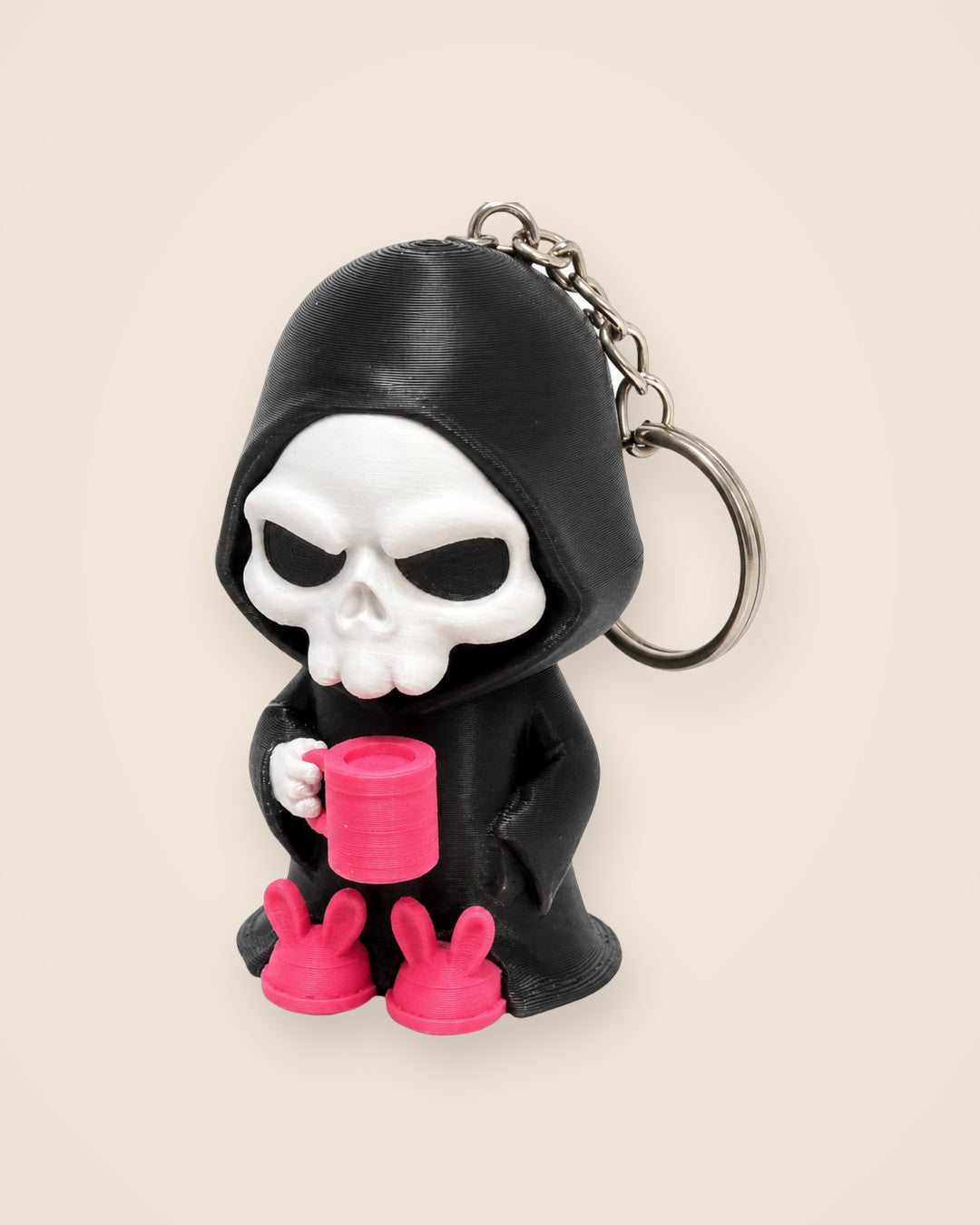 Coffee Break Reaper Keyring: Hooded reaper with a mug and bunny slippers, on a metal keyring