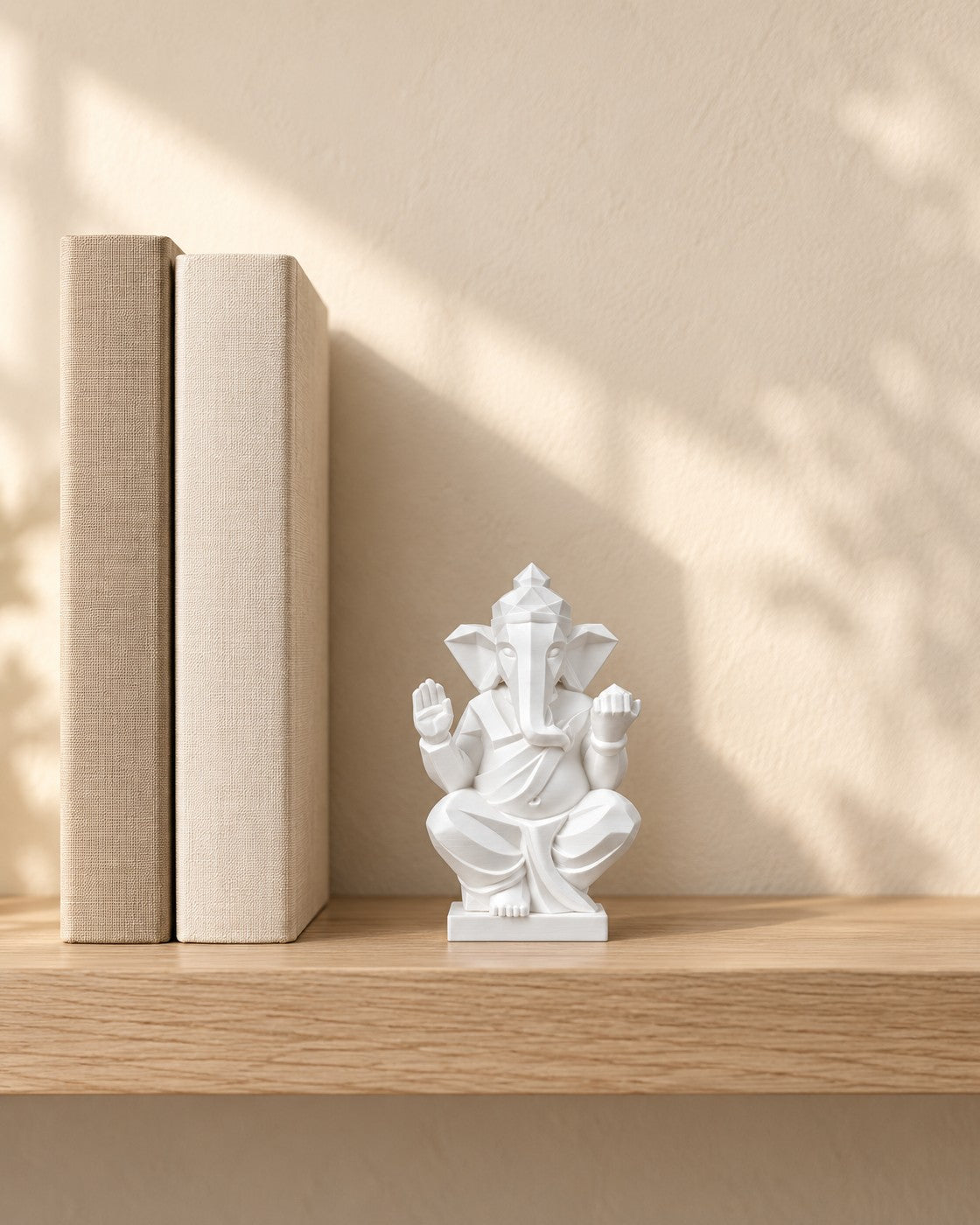 Faceted Ganesha Statue in a calm, softly lit interior, shown at true scale