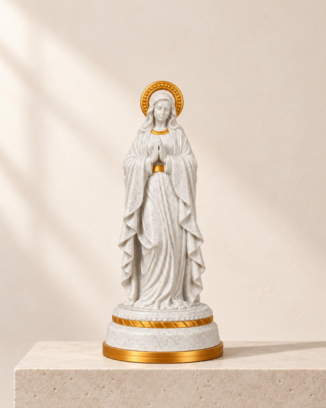 Our Lady Illuminated Statue: Praying figure with a warm LED glow rising from the base
