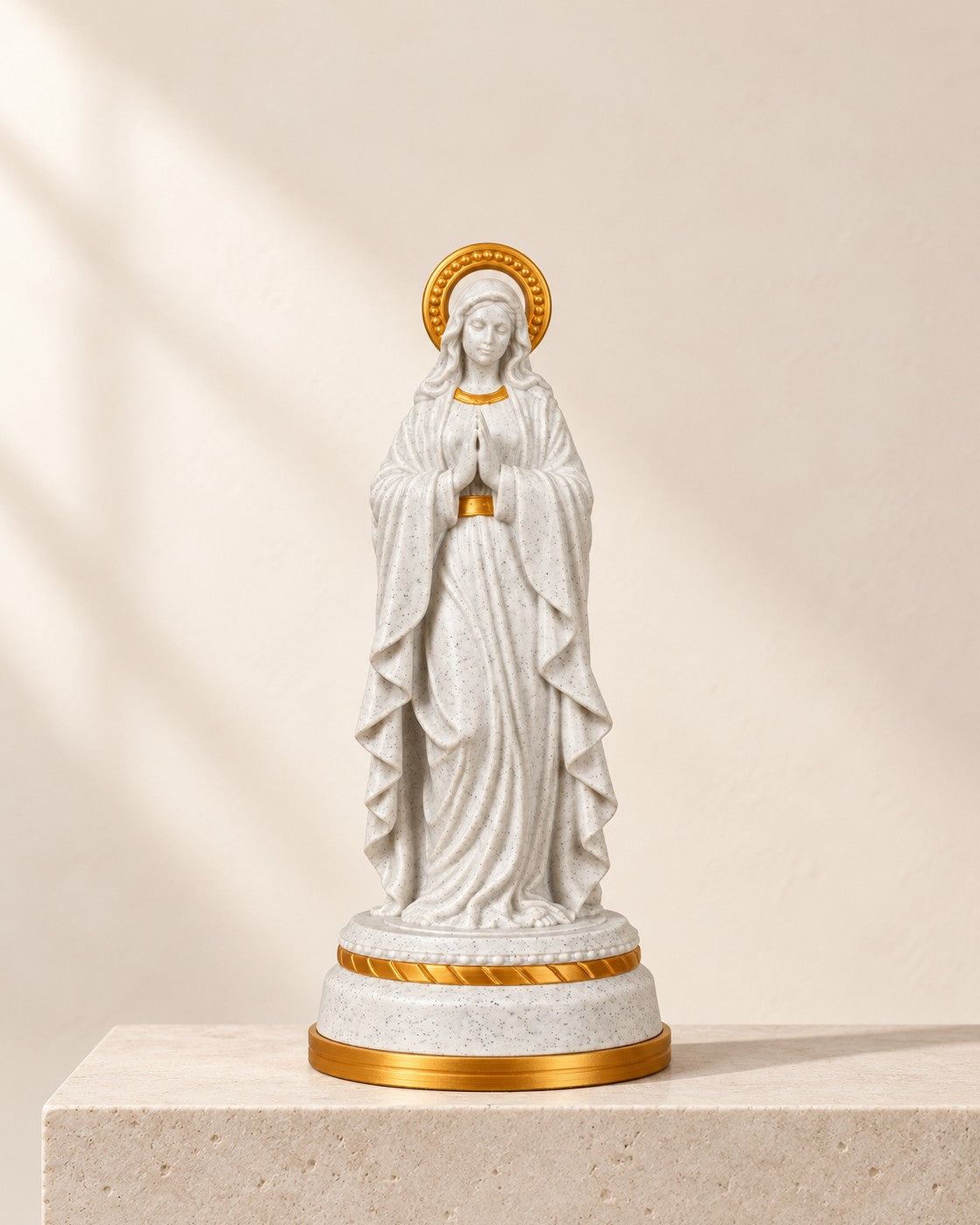 Our Lady Illuminated Statue on a pale limestone plinth, soft studio light