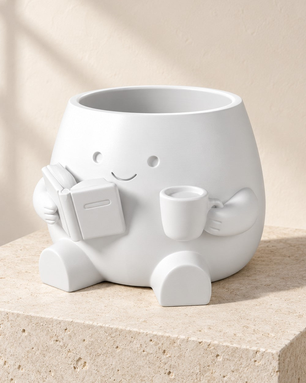 Book Lover Planter: A smiling reader holding a book and mug, with a drainage hole