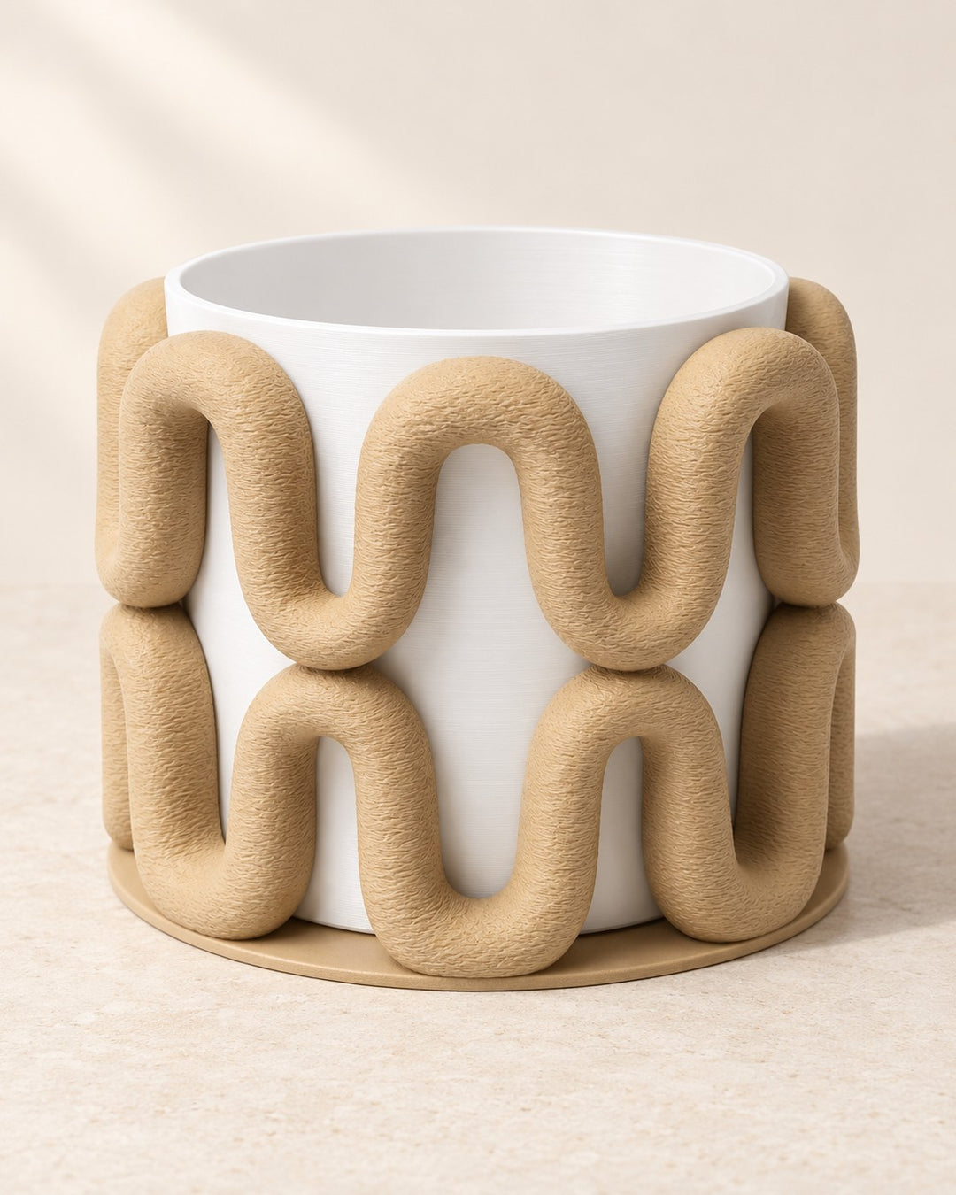 Sculptural Wave Planter: Beige wave-sculpted cachepot with a removable white inner pot