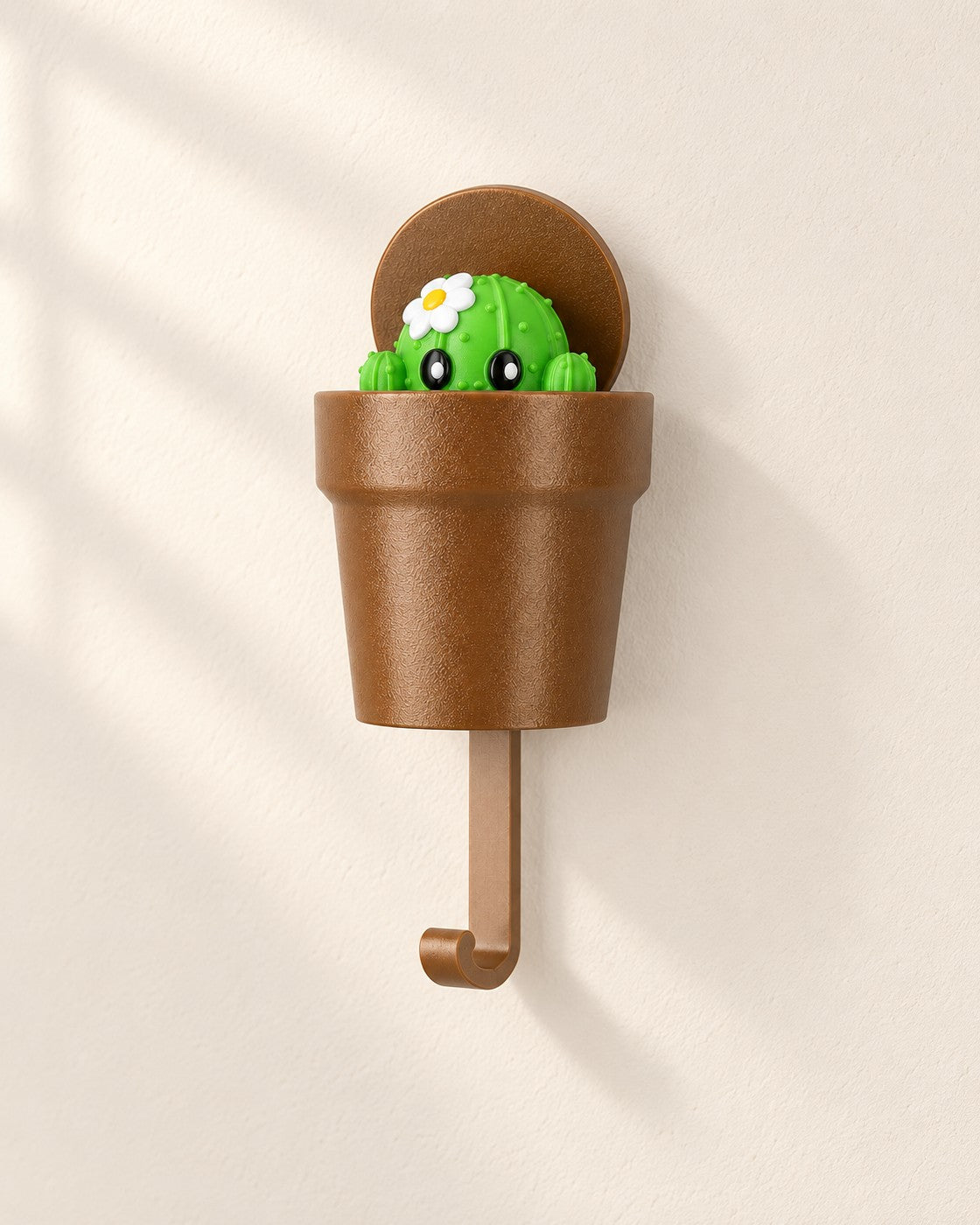 Pop-Up Cactus Key Holder on a pale limestone plinth, soft studio light