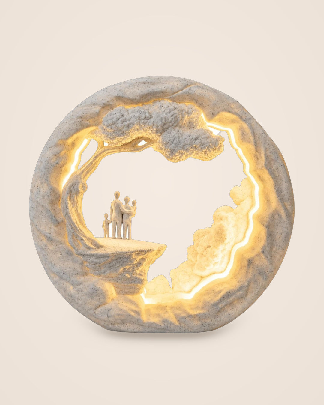 Family Tree Lamp: Marble-effect table lamp: four figures beneath a sculpted tree, lit in warm LED