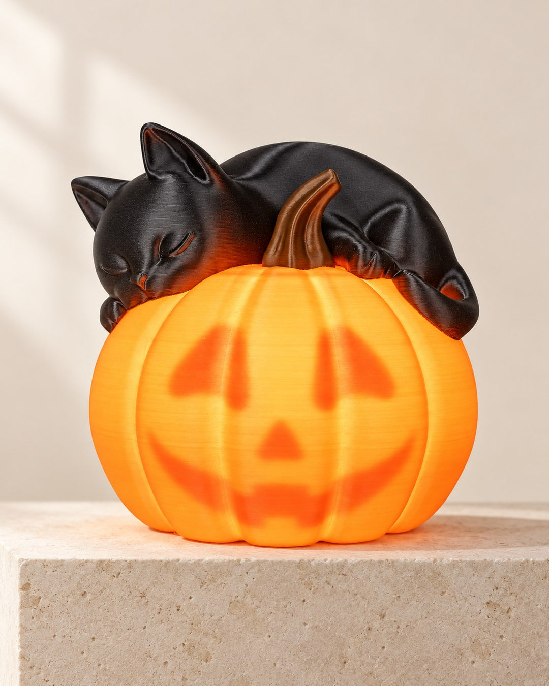 Sleepy Cat Pumpkin Lamp: A black cat dozing on a pumpkin that reveals its face when lit