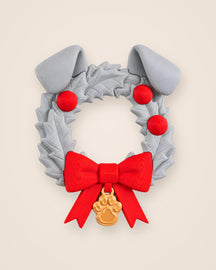 Dog Christmas Wreath: A holly ring with floppy ears, a red bow and a gold paw tag