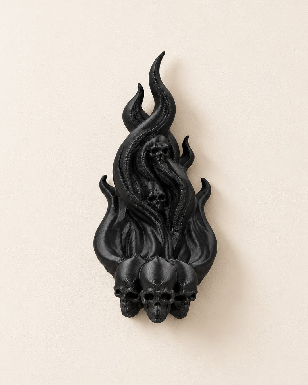 Dark Ember Headphone Hook: Wall-mounted hook shaped like a flame rising from three skulls